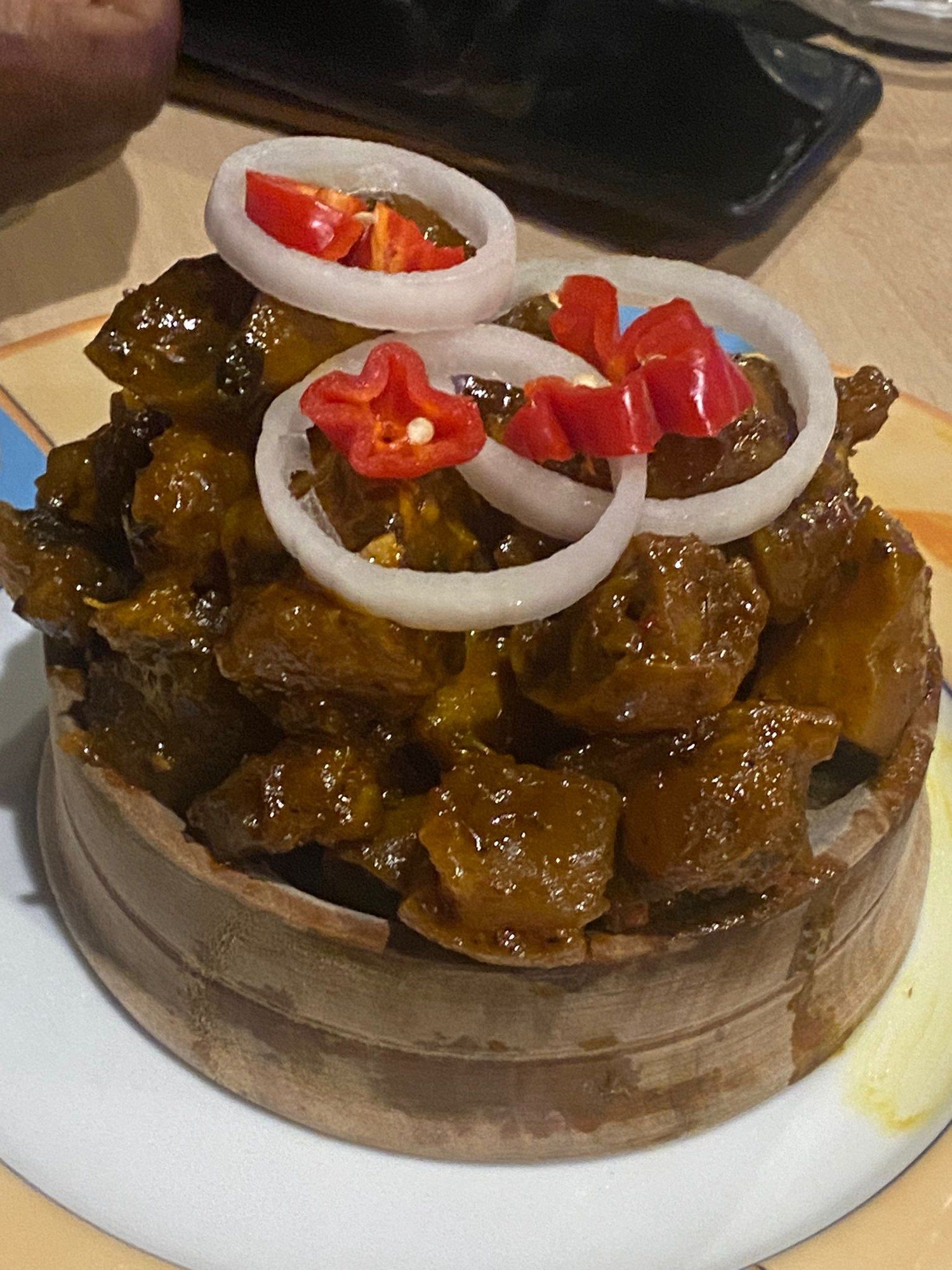 Nkwobi from the Afrolink kitchen, topped with onion rings and red pepper